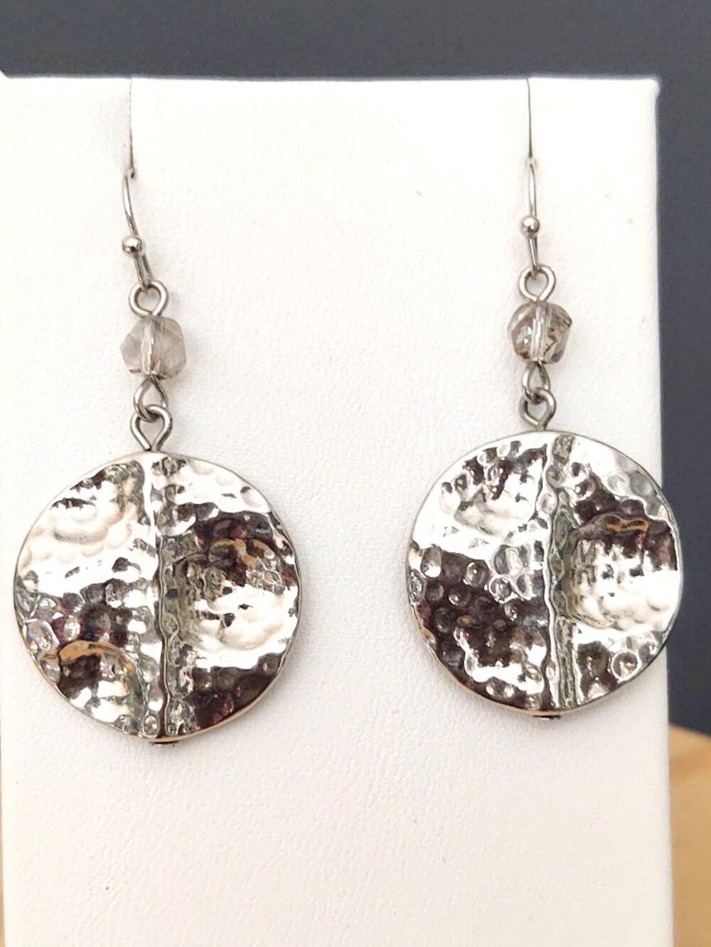 Hammered silver tone disk earrings with smoke crystal bead accents